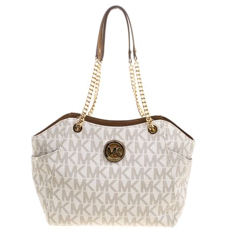 michael kors cream tan purse with pull chain|Michael Kors see through purse.